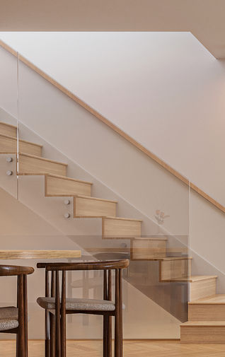 Architectural interior design rendering of ENZO townhomes on Vancouver’s West Side, showcasing spatial intelligence with natural light in every corner, a premium windowed stairwell, and a structural overhead skylight in vancouver's west side near oakridge park on a quiet inner street with future park front facing.