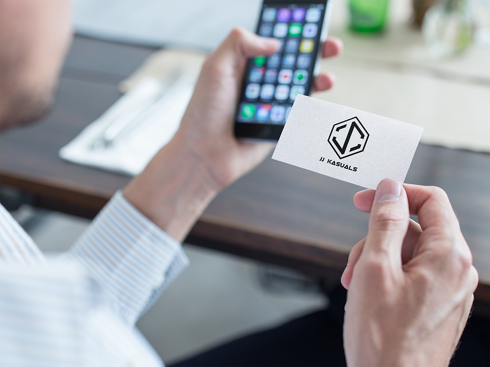JJKASUALS-mockup-of-a-business-man-using-JJKASUALS-business-card-with-his-phone