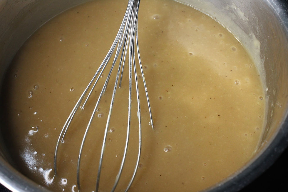 Picture of brown gravy forming after the addition of other ingredients.