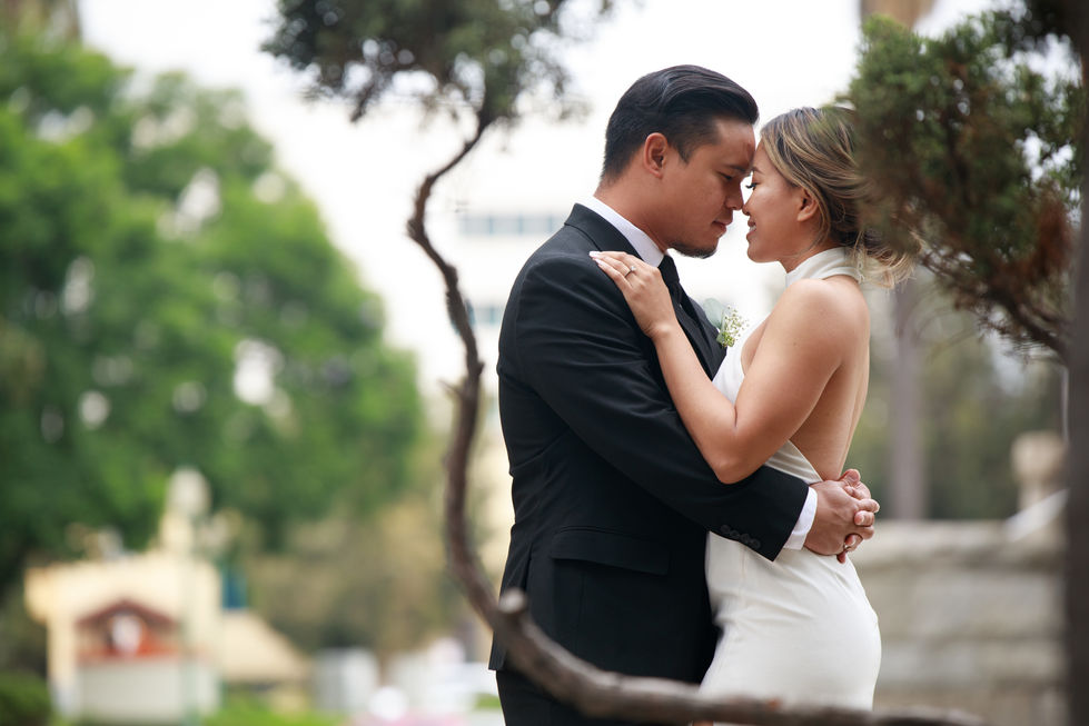 a bride and groom looking into each other 's eyes
