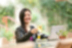 Woman with laptop by dating profile photographer