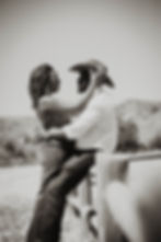 Couple by a fence by a couples photographer