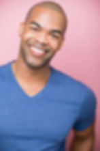 Smiling man in a photography portfolio gallery