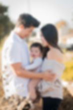 Family photography portfolio Orange County featuring happy parents with baby