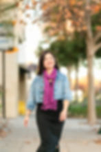 Woman walking outside for dating profile photography.