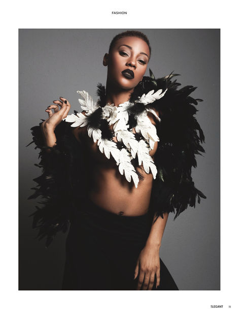 a woman with black and white feathers around her neck