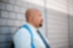 Man posing for a dating profile photographer outdoor portrait.