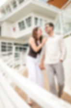 Couple walking and smiling by a couples photographer