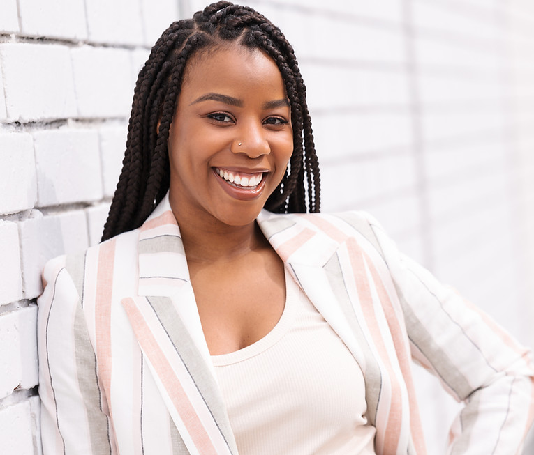 Smiling woman with braids in professional headshots