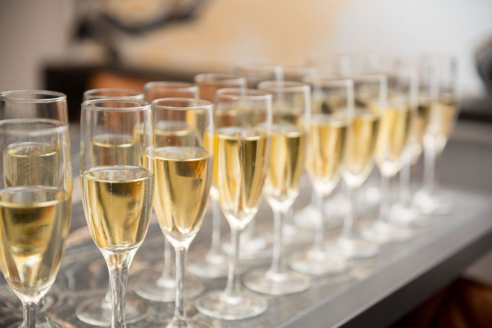 a row of champagne glasses are lined up on a table