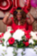 Smiling woman at her Birthday Party with a gold tiara