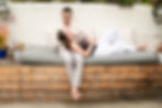 Laughing couple's engagement portraits by a photographer.