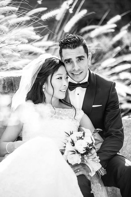 a black and white photo of a bride and groom