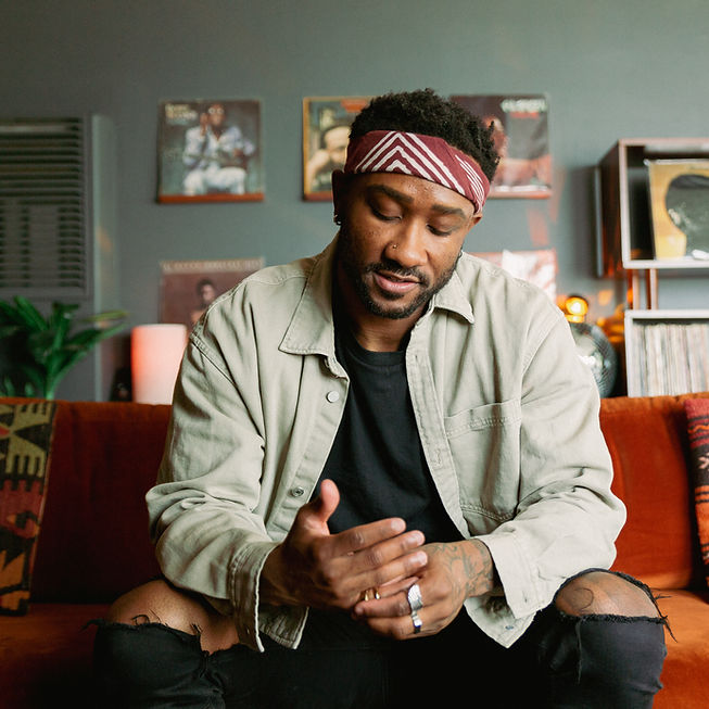 Man on couch by a dating profile photographer