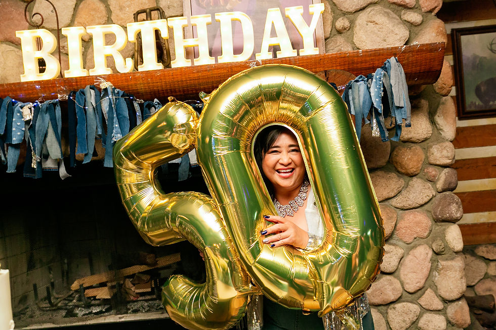 Woman at 50th birthday event held by an event photographer