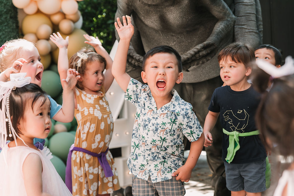 Excited children captured by a birthday party photographer.