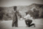 Man proposing to woman on a road, couples photographer.