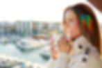 Woman holding coffee by a dating profile photographer