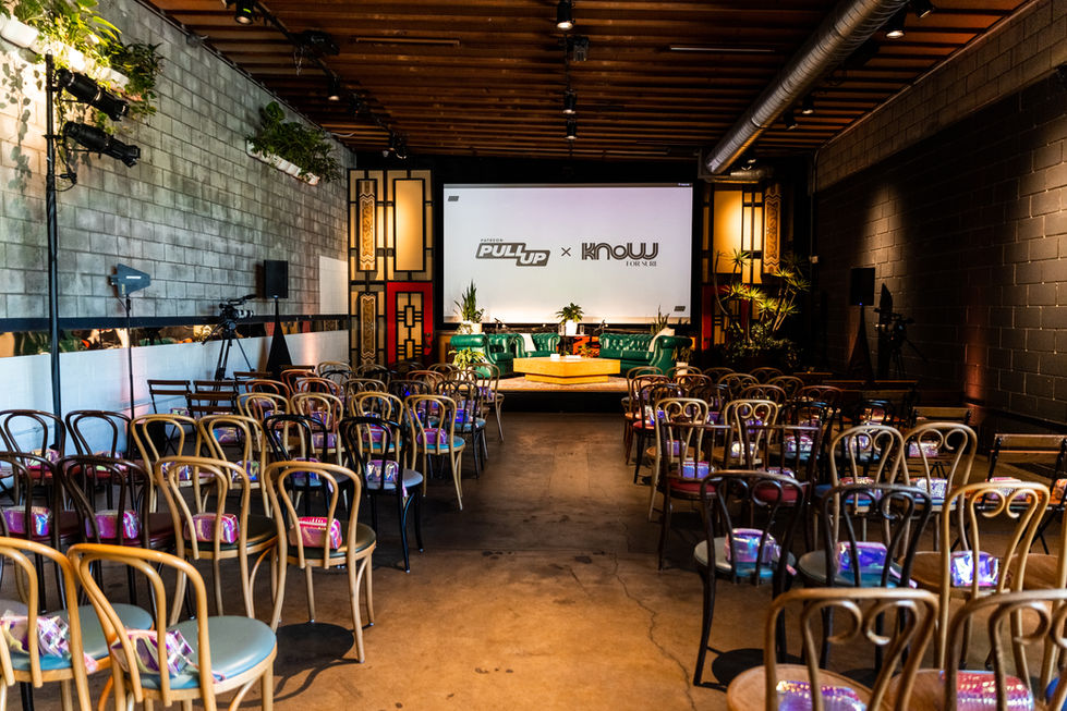 a large room with rows of chairs and a projector screen that says pullup x know group