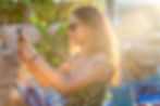 Woman taking a photo at a pool with a birthday party photographer