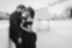 Couple in black formal attire by a couples photographer