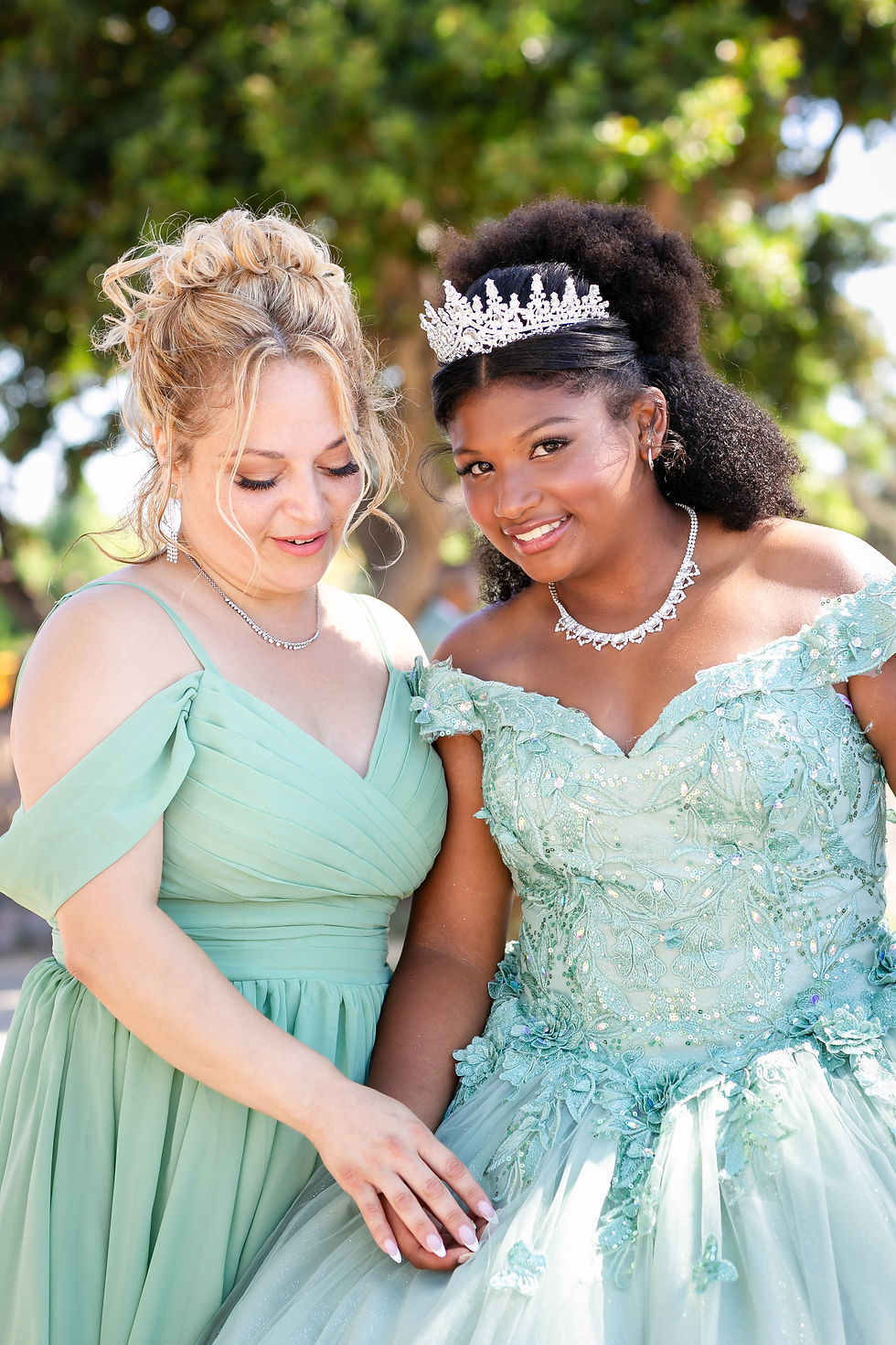 Quinceañera and mother captured by an event photographer.