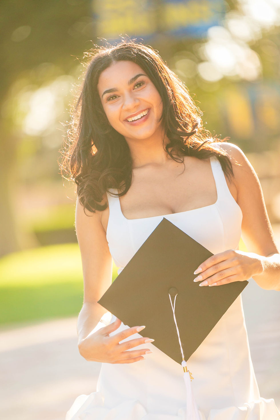 Graduate with cap by graduation photographer orange county