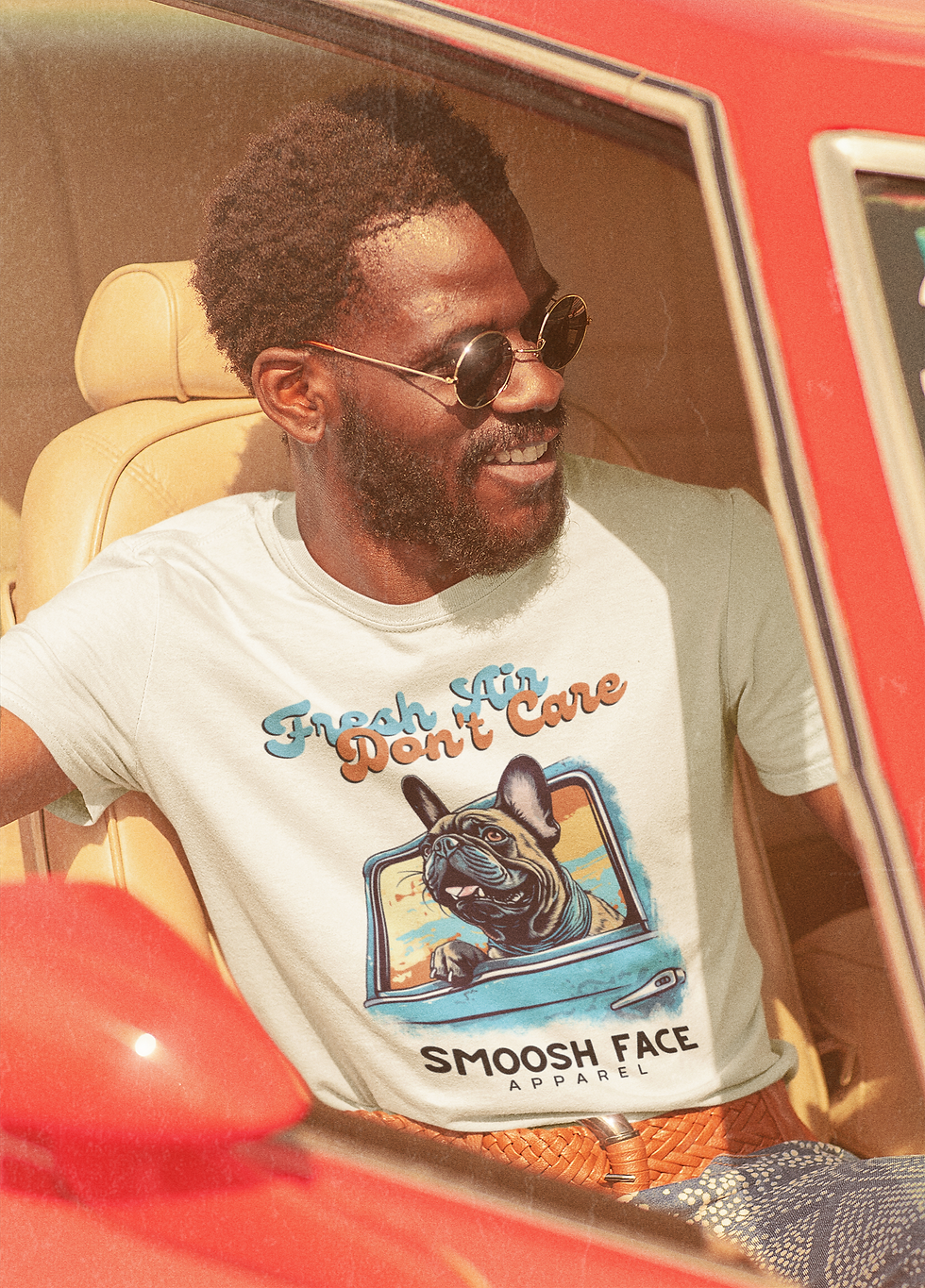 Thumbnail: Man wearing Fresh Air, Don't Care Frenchie Tee. French Bulldog hanging out car window.