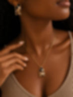 Woman wearing gold and black jewelry set
