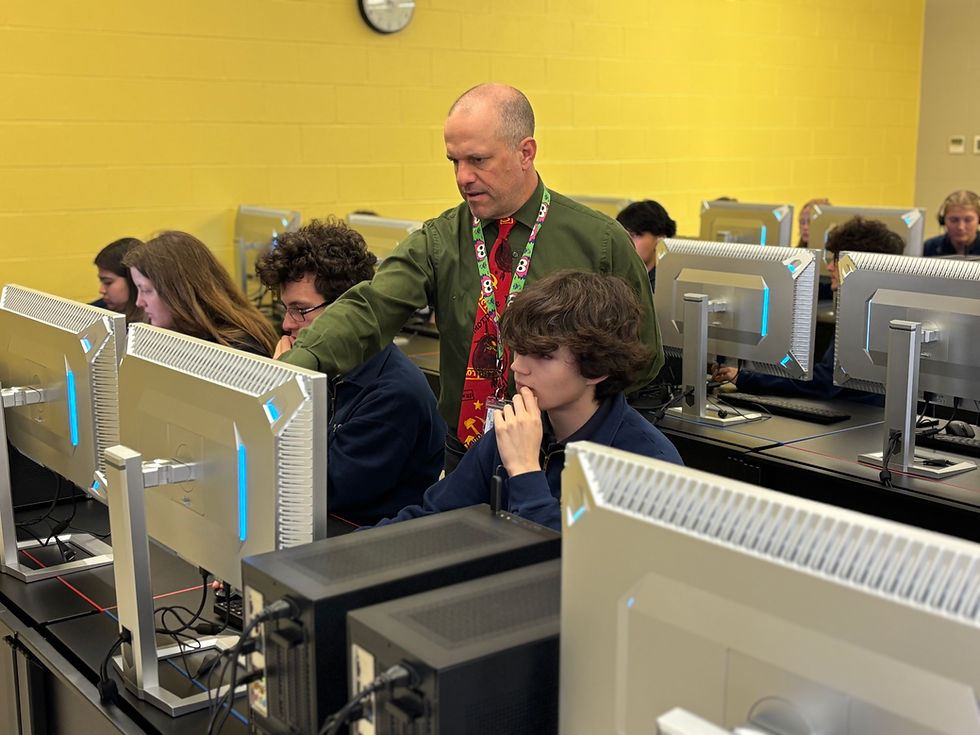 A photo of the a teacher instructing a student during interdisciplinary STEM class