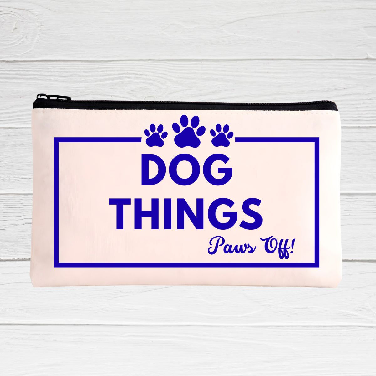 Canvas makeup bag with black zipper and wristlet, "Dog Things, Paws Off" in blue