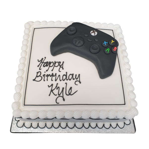 Bespoke celebration cake shaped like Xbox, PS4, and PS5 controllers in Solihull, West Midlands.
