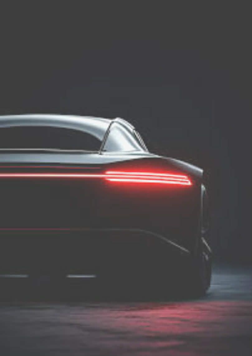 Sleek car rear with glowing red taillights
