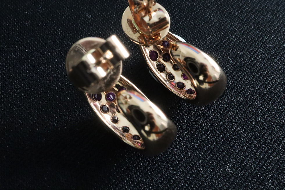Thumbnail: Ruby melee half hoop earring in 18k solid black and rose gold
