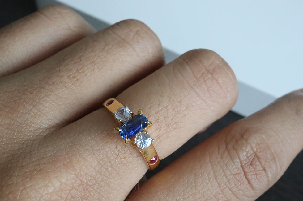 Thumbnail: Natural Blue Sapphire, White Sapphire & Ruby Ring Close Up
