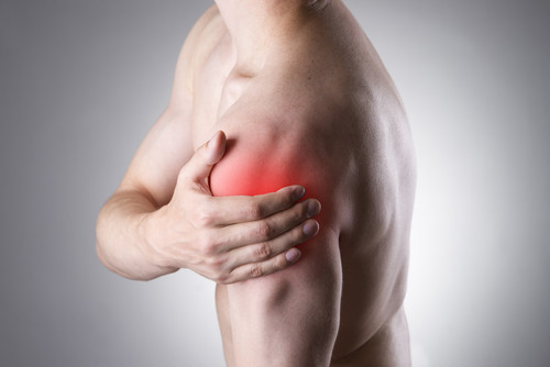 man holding sore shoulder