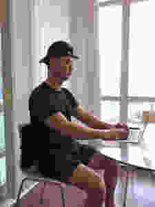 Sitting in chair with lumbar support and working on a laptop