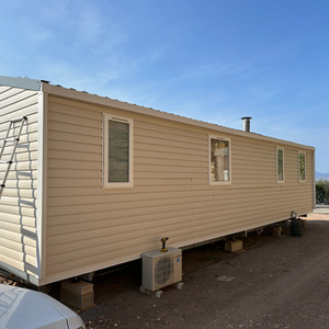 Pose artisanale de bardage bois sur mobil-home ancien