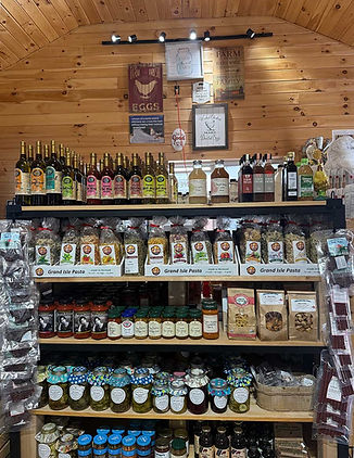 A photo of shelves at the Dreamwalker Farm Country store, loaded with delicious locally-made food products