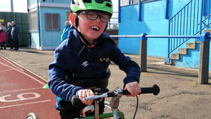 a boy on a running frame