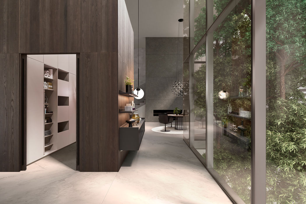Sleek handleless kitchen cabinets in a minimalist white kitchen design
