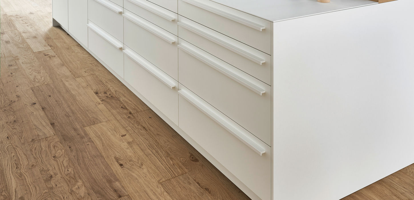 Transitional white kitchen cabinets blending classic and modern elements.