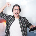 Excited Young Man Playing Video Games