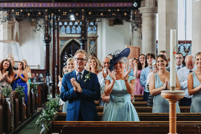 family and friends celebrating during isle of wight church wedding