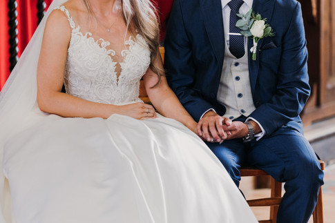 bride and groom hold hands during isle of wight church wedding