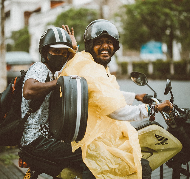 Kior-Travel-Man-Smiling-Motorbike-Rain-P