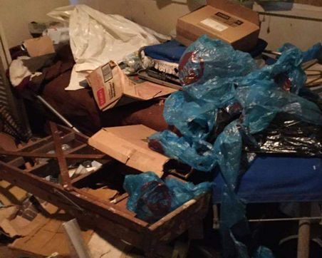 a room with trash and clutter