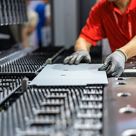 Cybersecurity engineer inspecting IIoT-enabled machinery