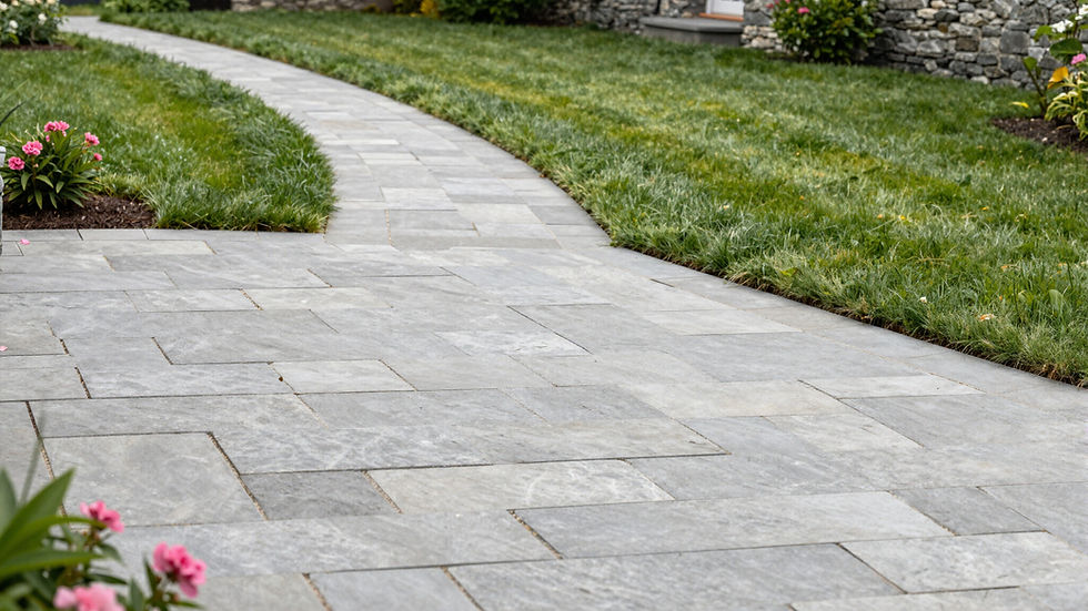 Curved gray stone walkway with hardscaping services near me.
