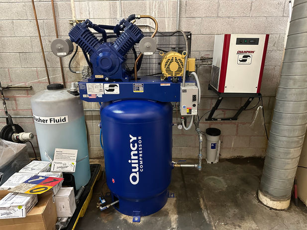 Quincy reciprocating piston air compressor.